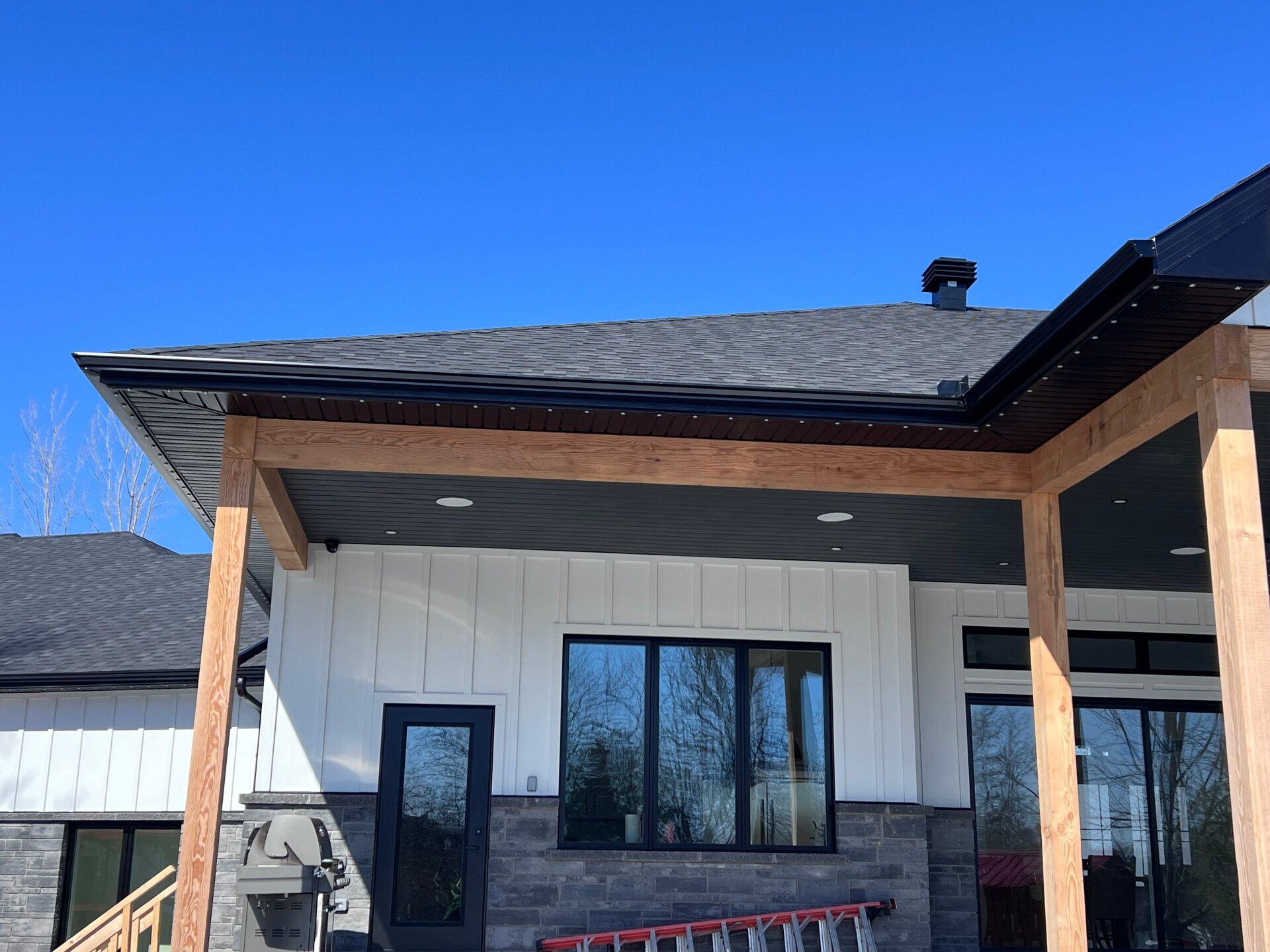 Soffit, fascia and cedar beam accents on a Barrhaven covered porch